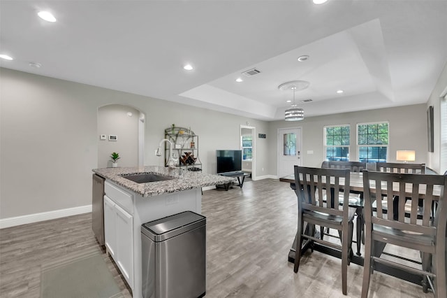 530 E Day St, Denison, TX 75021 - kitchen with stainless steel dishwasher, visible vents, a sink, and a raised ceiling