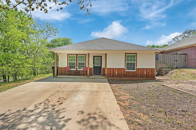 530 E Day St, Denison, TX 75021 - view of front of home featuring a porch, roof with shingles, and concrete driveway