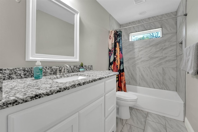 530 E Day St, Denison, TX 75021 - full bathroom featuring vanity, visible vents, toilet, shower / bath combo, and marble finish floor