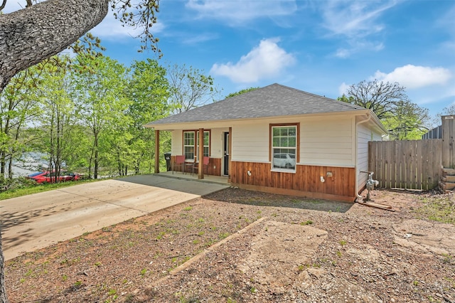 530 E Day St, Denison, TX 75021 - bungalow-style house with fence, a shingled roof, covered porch, and driveway