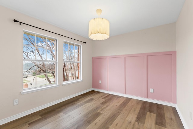 322 Ashley Oak Ln, Lake Dallas, TX 75065 - unfurnished dining area with wood finished floors and baseboards