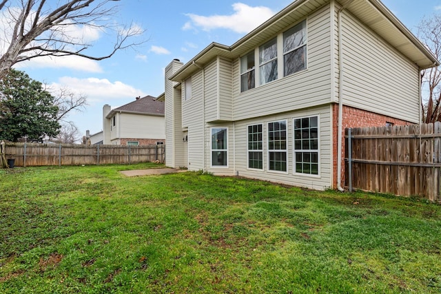 322 Ashley Oak Ln, Lake Dallas, TX 75065 - back of house with a yard, a fenced backyard, and brick siding