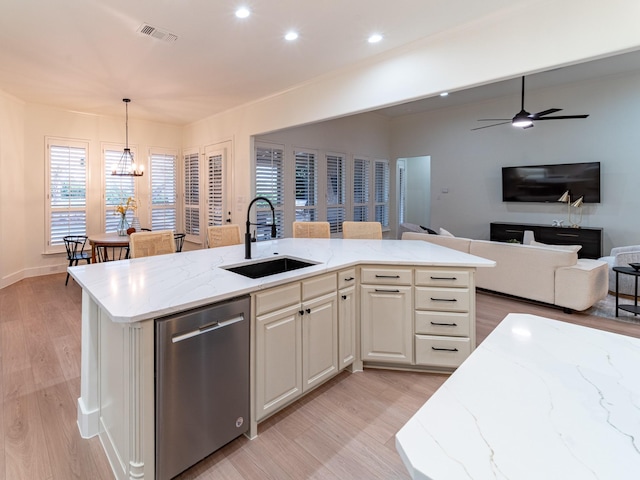 5454 Pebble Creek Dr, Celina, TX 75078 - kitchen with visible vents, dishwasher, a sink, ceiling fan, and light stone counters