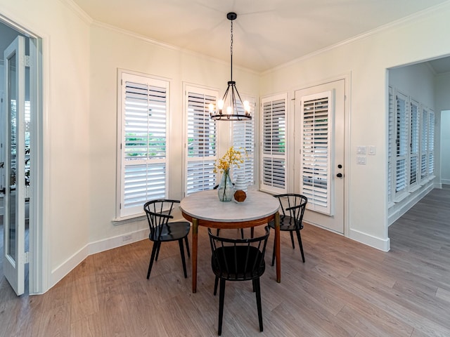 5454 Pebble Creek Dr, Celina, TX 75078 - dining space featuring a notable chandelier, baseboards, ornamental molding, and wood finished floors