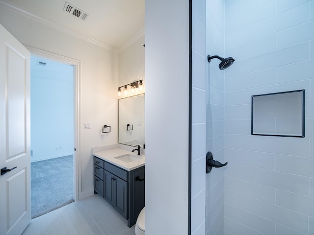 5454 Pebble Creek Dr, Celina, TX 75078 - bathroom featuring crown molding, visible vents, tiled shower, and vanity