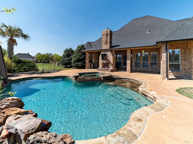 5454 Pebble Creek Dr, Celina, TX 75078 - view of pool featuring a patio, a pool with connected hot tub, fence, and an outdoor stone fireplace