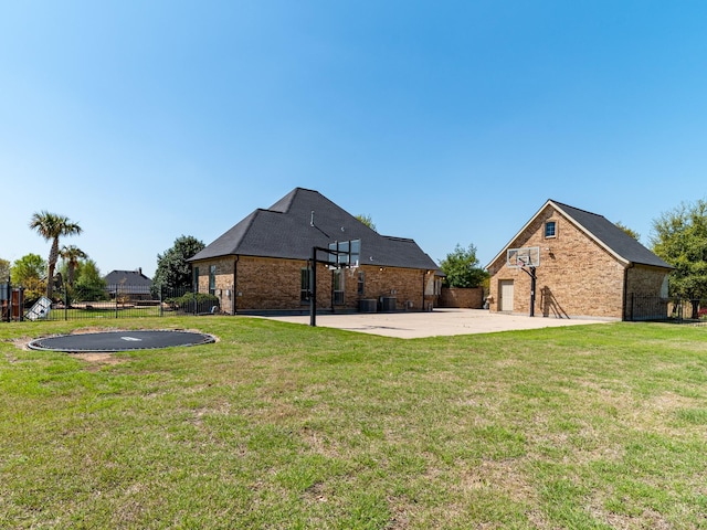 5454 Pebble Creek Dr, Celina, TX 75078 - view of yard featuring a trampoline, a patio area, and fence