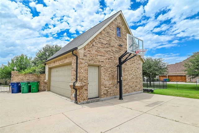 5454 Pebble Creek Dr, Celina, TX 75078 - view of property exterior with a yard, an attached garage, fence, concrete driveway, and brick siding