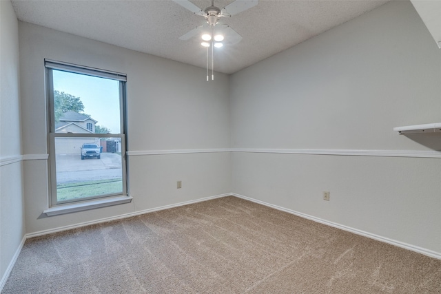 6605 Bluebonnet Dr, Rowlett, TX 75089 - carpeted empty room with baseboards, ceiling fan, and a textured ceiling