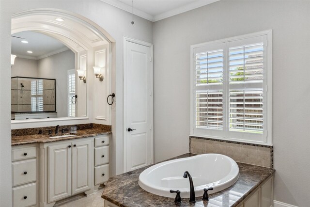 7217 Deer Field Dr, Mansfield, TX 76063 - bathroom featuring crown molding, a bath, tiled shower, vanity, and recessed lighting