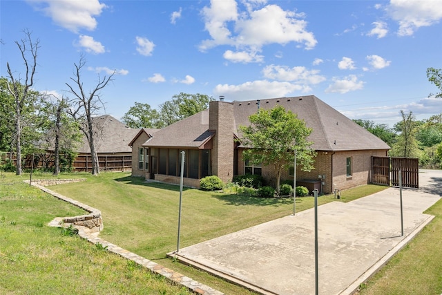 7217 Deer Field Dr, Mansfield, TX 76063 - back of house featuring fence, roof with shingles, a yard, and a patio