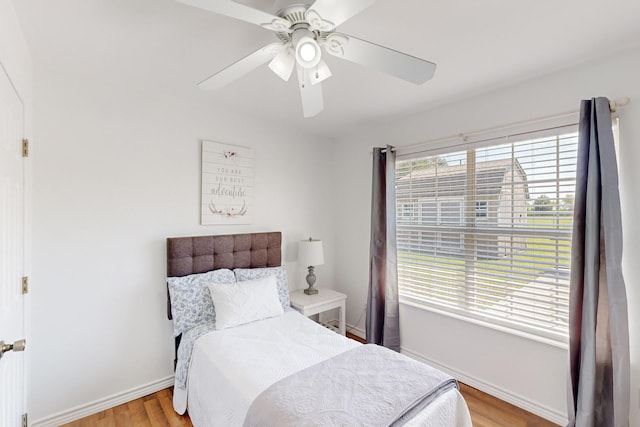 5609 Cedar Creek Dr, Kemp, TX 75143 - bedroom featuring multiple windows, light wood-type flooring, baseboards, and a ceiling fan