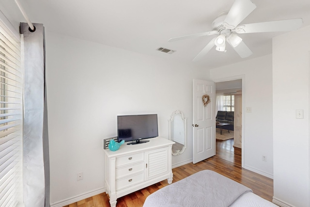 5609 Cedar Creek Dr, Kemp, TX 75143 - bedroom with wood finished floors, ceiling fan, and baseboards