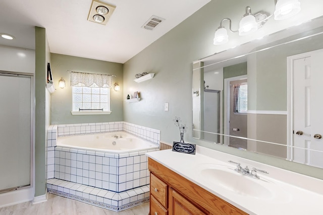5609 Cedar Creek Dr, Kemp, TX 75143 - bathroom with healthy amount of natural light, a shower stall, a garden tub, and vanity