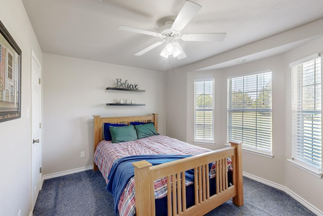 5609 Cedar Creek Dr, Kemp, TX 75143 - bedroom with carpet, multiple windows, baseboards, and a ceiling fan