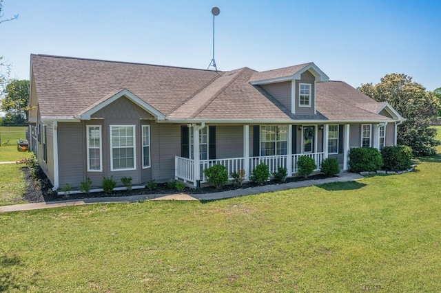 5609 Cedar Creek Dr, Kemp, TX 75143 - view of front of property with a porch, a front yard, and a shingled roof