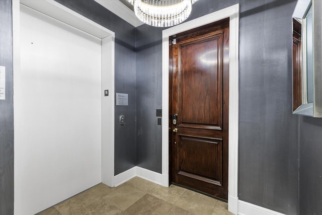6615 Bandera Ave Unit 1A, Dallas, TX 75225 - entryway with a chandelier, baseboards, elevator, and light tile patterned floors