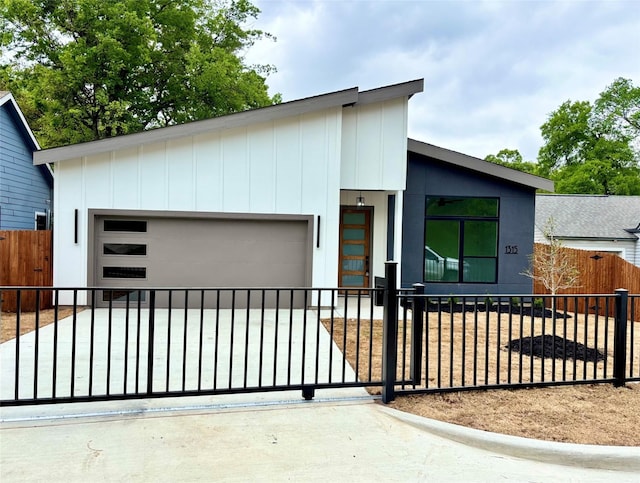 1315 Renner Dr, Dallas, TX 75216 - contemporary house featuring a fenced front yard and a garage
