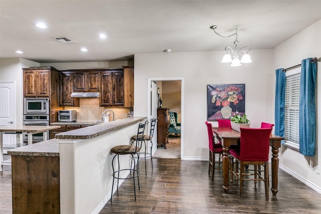 701 Ireland Way, Wylie, TX 75098 - living room with ceiling fan with notable chandelier, baseboards, plenty of natural light, and carpet flooring
