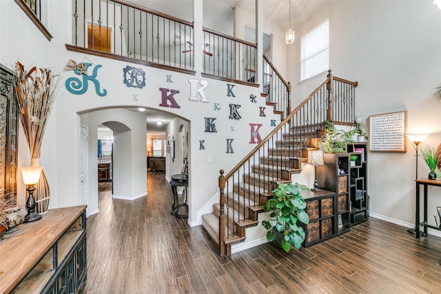 701 Ireland Way, Wylie, TX 75098 - interior space with baseboards, a high ceiling, wood finished floors, and a notable chandelier
