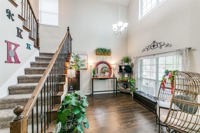 701 Ireland Way, Wylie, TX 75098 - interior space with visible vents, wood finished floors, a high ceiling, stairway, and arched walkways