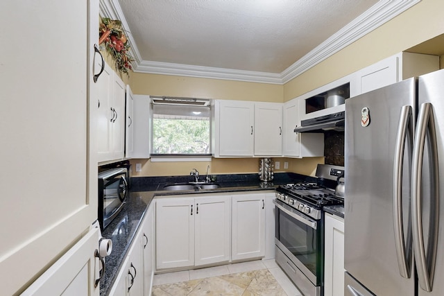 kitchen with under cabinet range hood, stainless steel appliances, ornamental molding, a sink, and white cabinetry