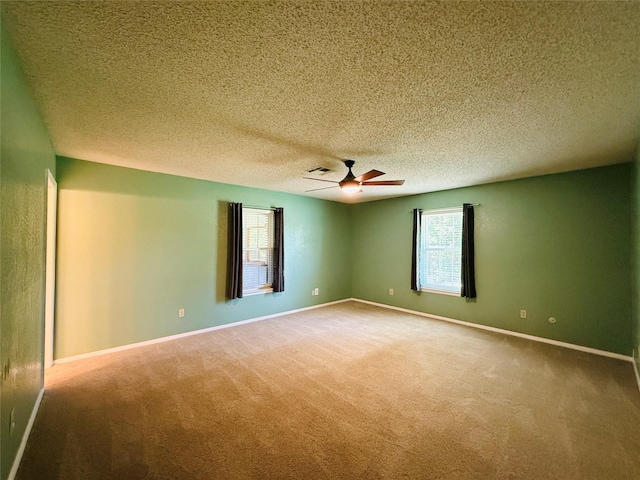 100 Russell St, Lorena, TX 76655 - unfurnished room with a ceiling fan, carpet, baseboards, and a textured ceiling
