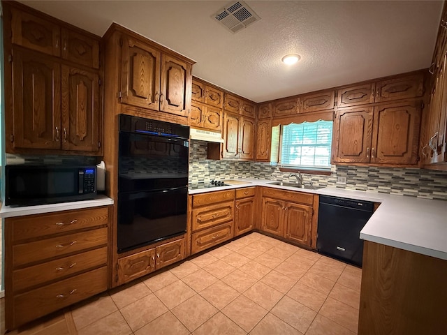 100 Russell St, Lorena, TX 76655 - kitchen featuring black appliances, a sink, under cabinet range hood, backsplash, and light tile patterned floors