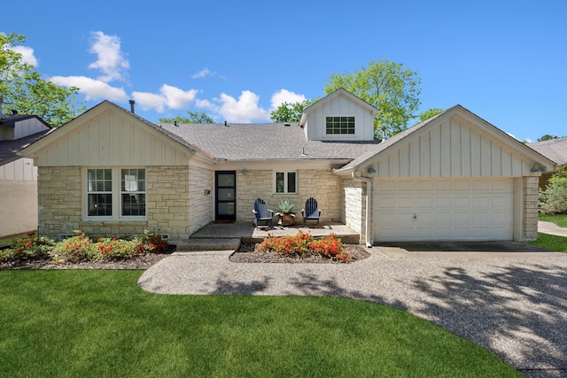 9431 Waterview Rd, Dallas, TX 75218 - view of front of property with a garage, stone siding, a front lawn, a shingled roof, and driveway