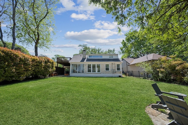 9431 Waterview Rd, Dallas, TX 75218 - rear view of house with a yard, stone siding, fence, and a chimney