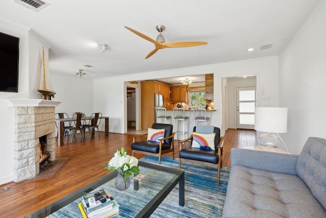 9431 Waterview Rd, Dallas, TX 75218 - living area with crown molding, wood finished floors, ceiling fan, and visible vents