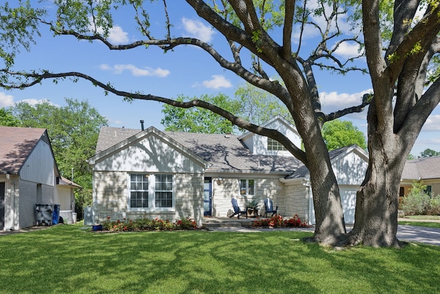 9431 Waterview Rd, Dallas, TX 75218 - view of front of house featuring a front yard, stone siding, and roof with shingles