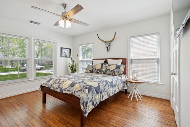 9431 Waterview Rd, Dallas, TX 75218 - bedroom featuring wood-type flooring, baseboards, ceiling fan, and visible vents