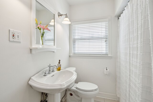 9431 Waterview Rd, Dallas, TX 75218 - bathroom with toilet, tile patterned floors, a shower with curtain, and a sink