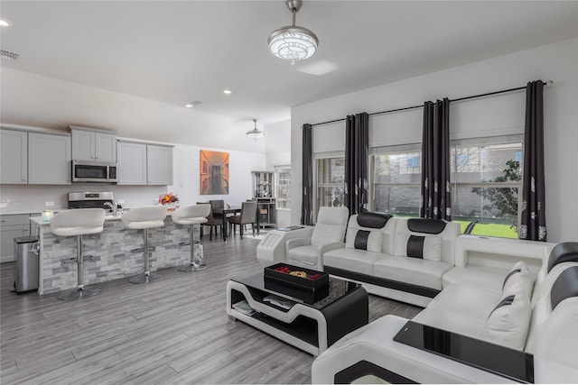 4512 Hiddenite Rd, Little Elm, TX 76227 - living room with light wood finished floors and recessed lighting