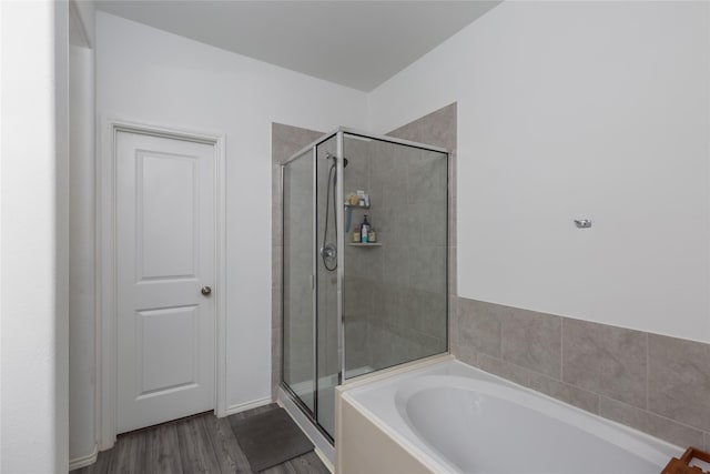 4512 Hiddenite Rd, Little Elm, TX 76227 - full bath featuring a bath, a shower stall, and wood finished floors