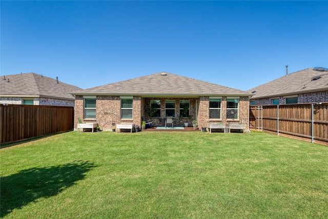 4512 Hiddenite Rd, Little Elm, TX 76227 - rear view of house featuring brick siding, a patio, and roof with shingles