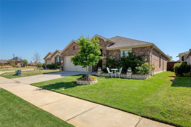 4512 Hiddenite Rd, Little Elm, TX 76227 - view of front of home featuring brick siding, driveway, a garage, and a front yard