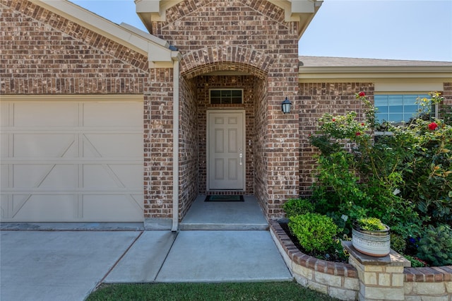 4512 Hiddenite Rd, Little Elm, TX 76227 - entrance to property with brick siding, a garage, and concrete driveway