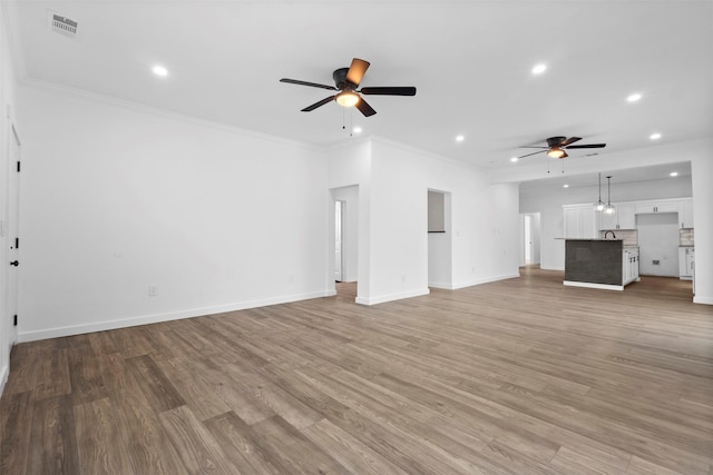 unfurnished living room featuring recessed lighting, light wood-style flooring, and ceiling fan