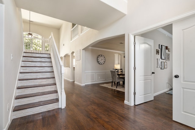 3733 Glassenberry St, Fort Worth, TX 76244 - stairway with crown molding, arched walkways, and wood finished floors