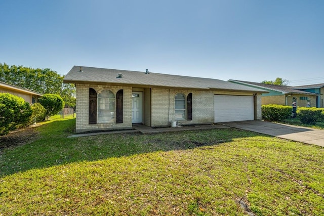 view of front of house with brick siding, driveway, a garage, and a front lawn