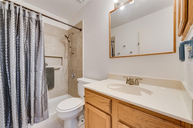 1128 Germany Dr, Cedar Hill, TX 75104 - bathroom with toilet, a textured ceiling, vanity, tile patterned floors, and tiled shower