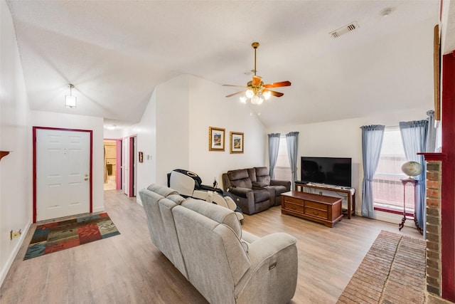 1128 Germany Dr, Cedar Hill, TX 75104 - living room featuring visible vents, baseboards, a ceiling fan, light wood finished floors, and vaulted ceiling