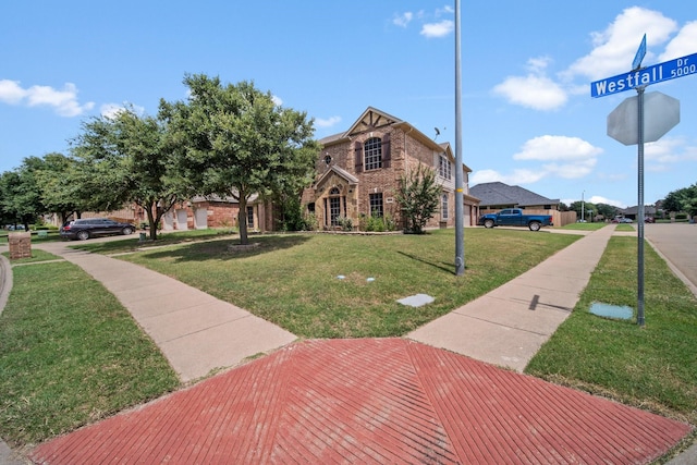 5038 W Fall Dr, Midlothian, TX 76065 - view of front facade featuring a front lawn and brick siding