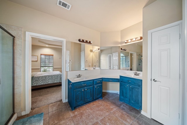 5038 W Fall Dr, Midlothian, TX 76065 - bathroom featuring a shower stall, double vanity, visible vents, and a sink