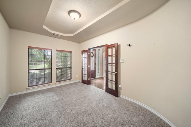 5038 W Fall Dr, Midlothian, TX 76065 - carpeted empty room featuring baseboards, french doors, a tray ceiling, and visible vents