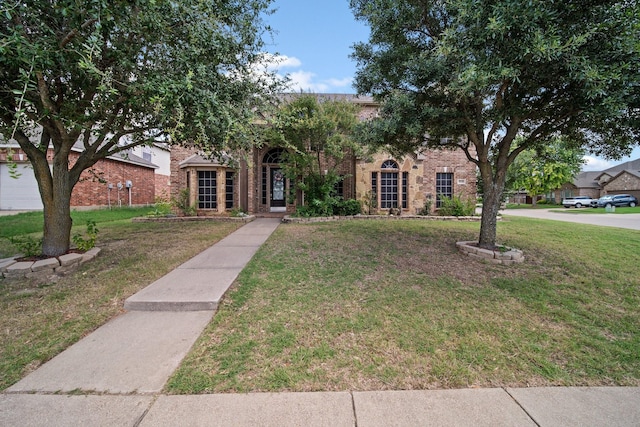 5038 W Fall Dr, Midlothian, TX 76065 - view of front of home featuring a front yard and brick siding