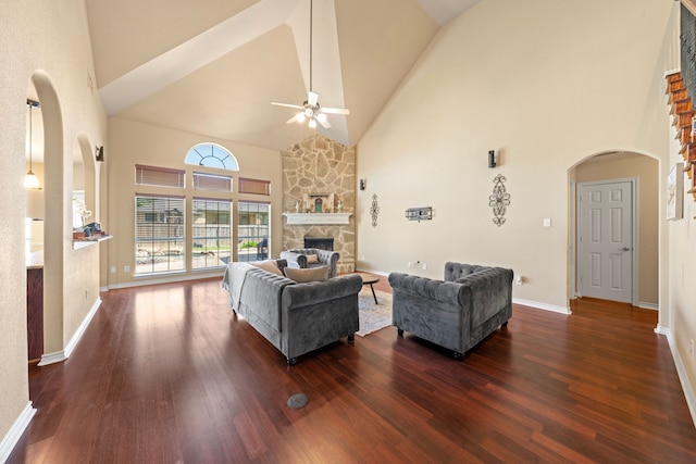 5038 W Fall Dr, Midlothian, TX 76065 - living area with dark wood-style flooring, a fireplace, a ceiling fan, high vaulted ceiling, and arched walkways