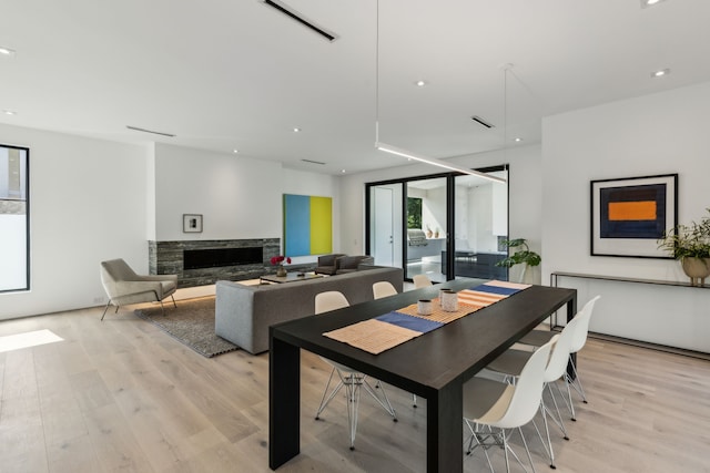 5101 Vickery Blvd, Dallas, TX 75206 - dining room featuring a stone fireplace, light wood-type flooring, and recessed lighting